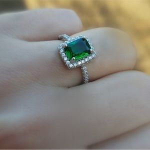 Green emerald rectangle halo silver ring